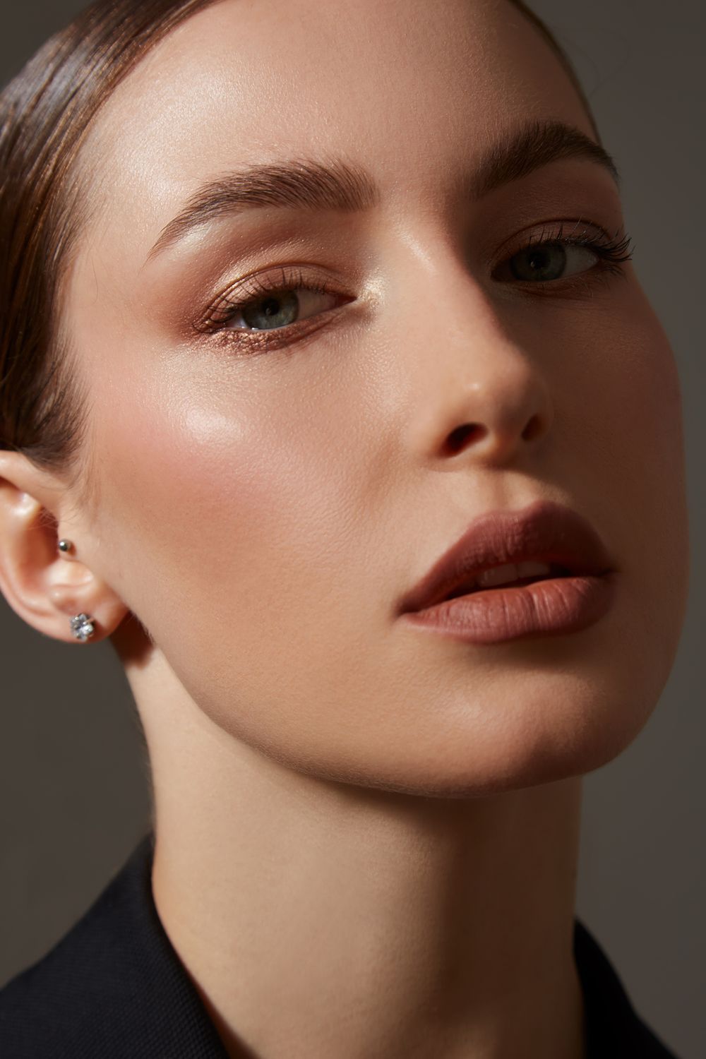 Close-up of a woman's face with makeup.