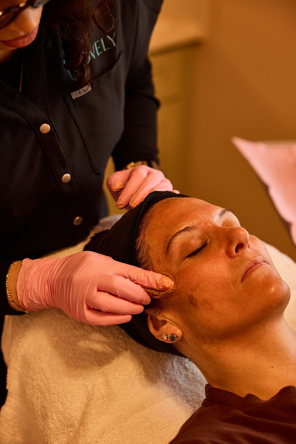 Facial treatment in progress at a spa.