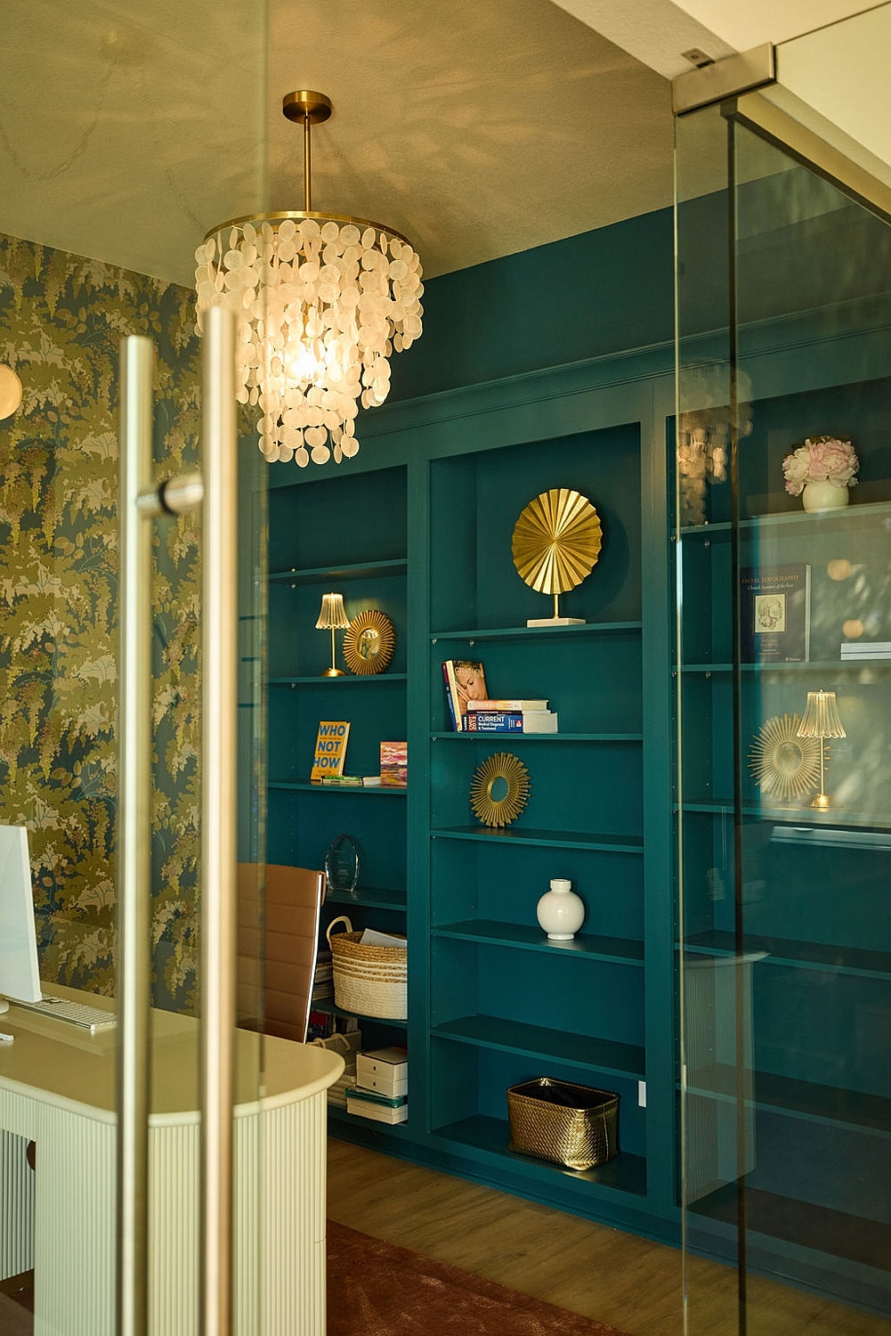 Stylish home office with blue accent wall.