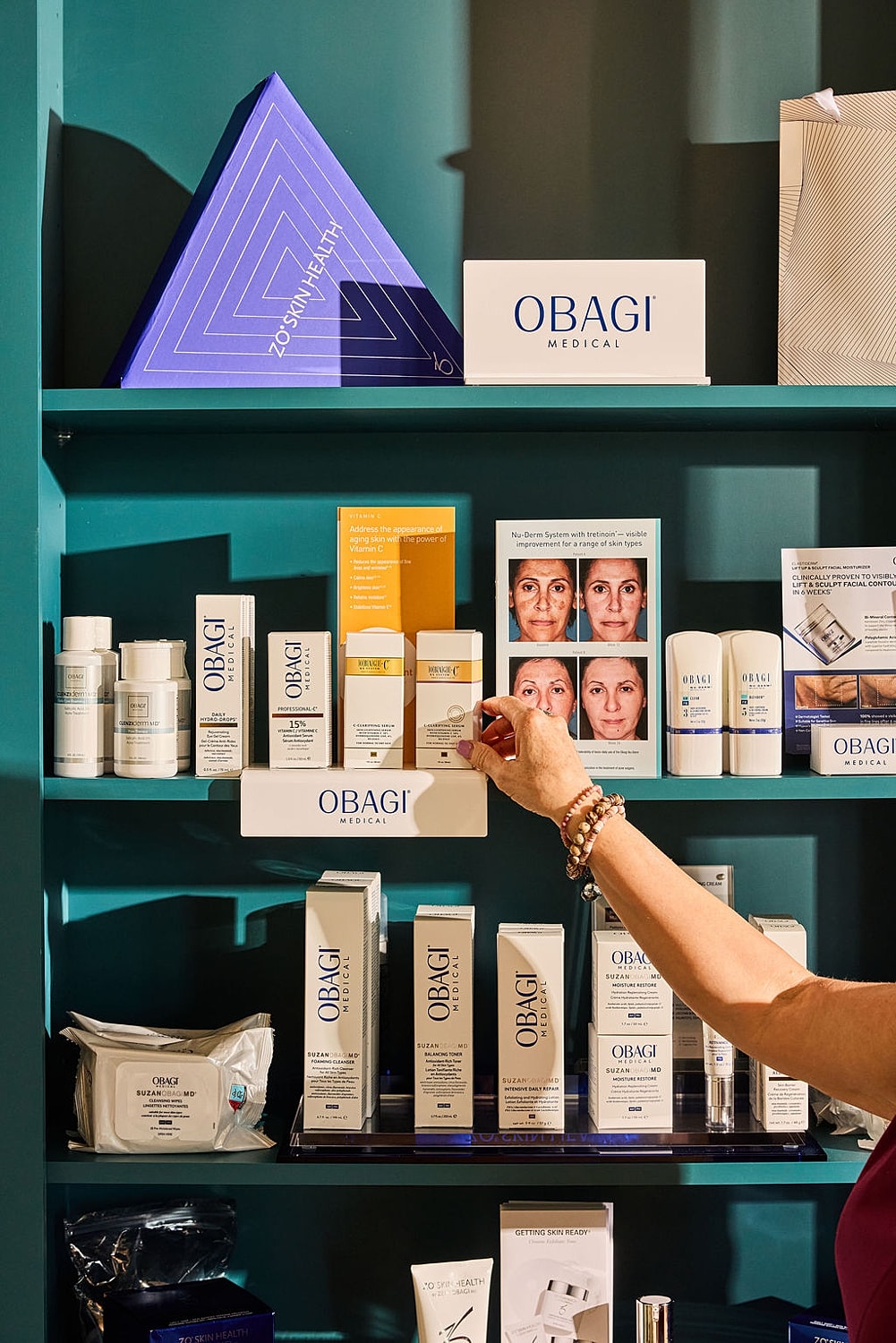 Skincare products displayed on a shelf.