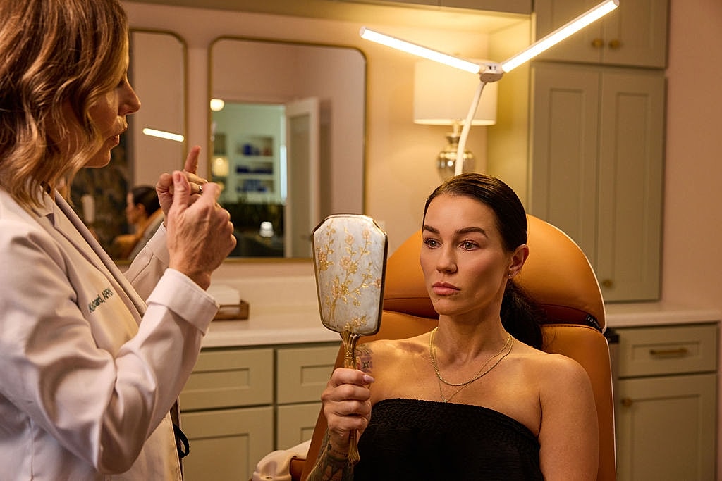 Smiling woman wearing a straw hat with background.