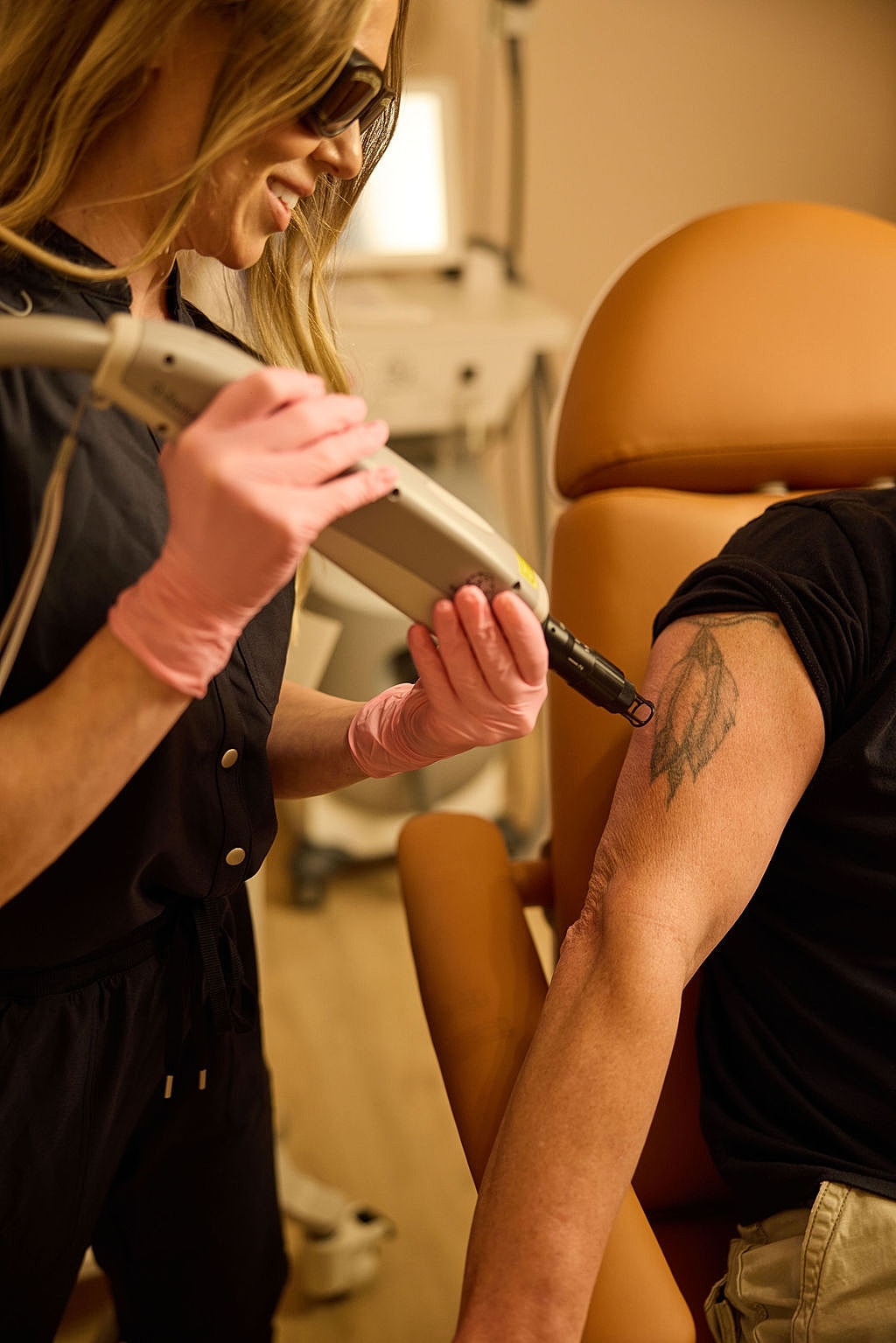 Laser tattoo removal in progress on neck.