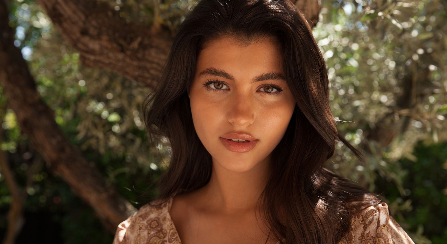 Portrait of a woman in natural surroundings.